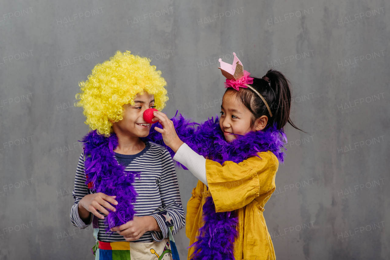 Portrait of two children in funny costumes.