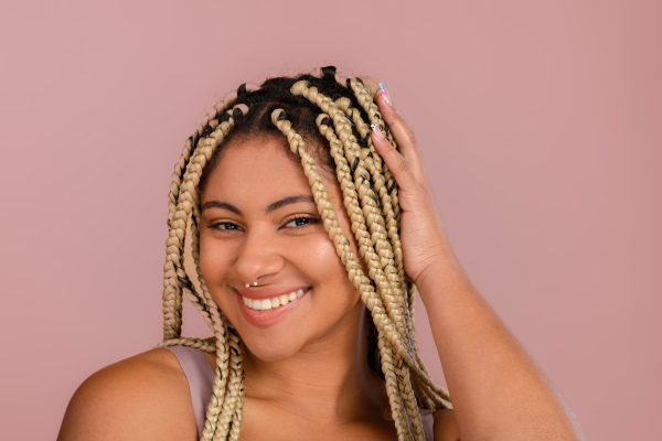 Portrait of a happy multiracial woman, studio shoot.