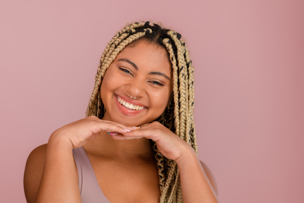 Portrait of a happy multiracial woman, studio shoot.