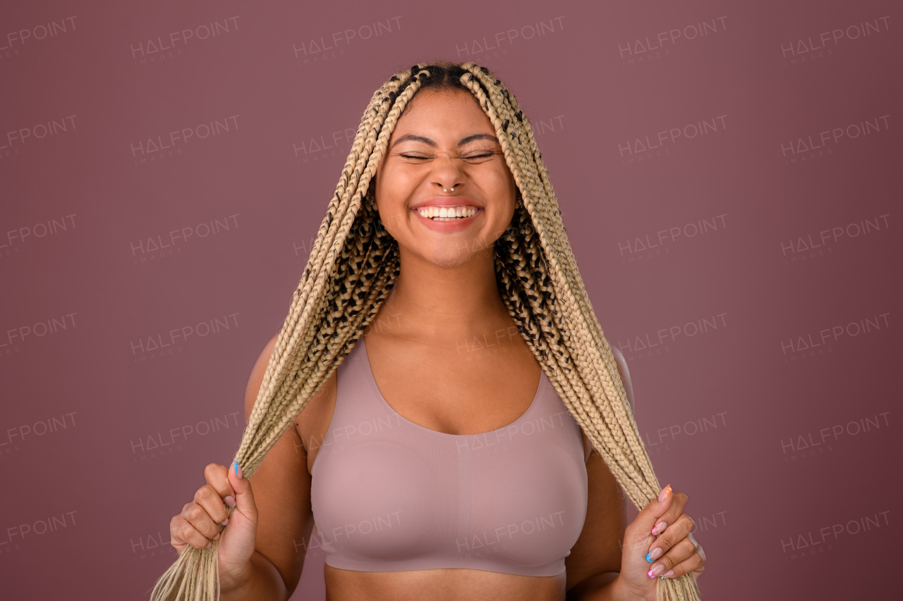 Portrait of a happy multiracial woman, studio shoot.