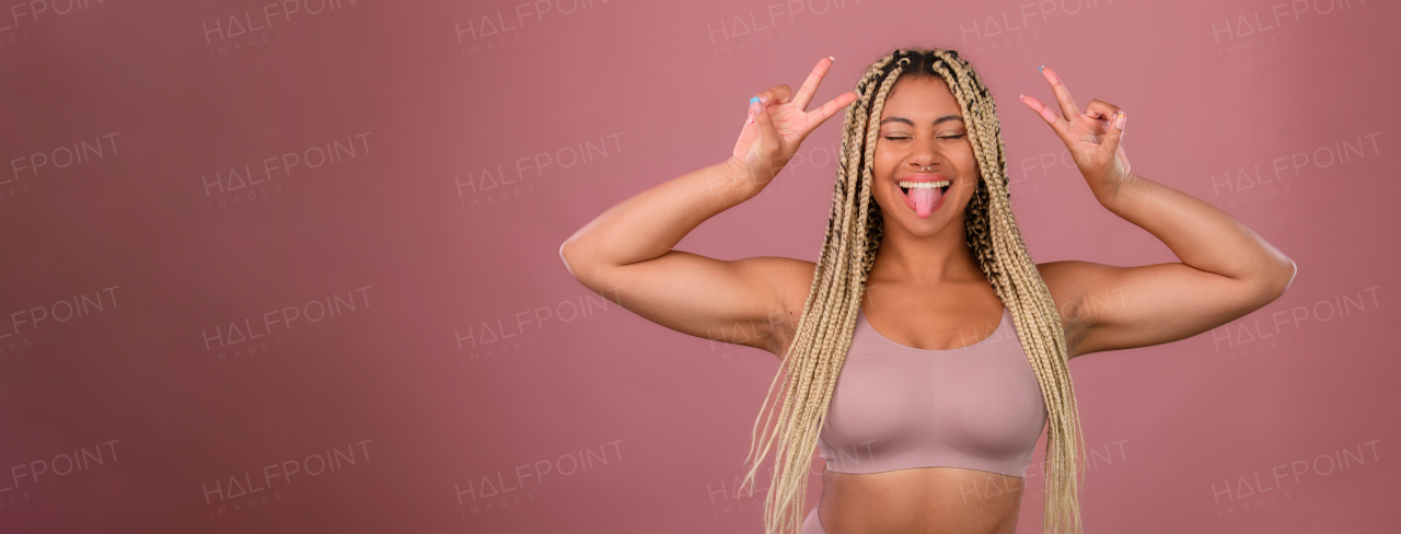 Portrait of a happy multiracial woman, studio shoot.