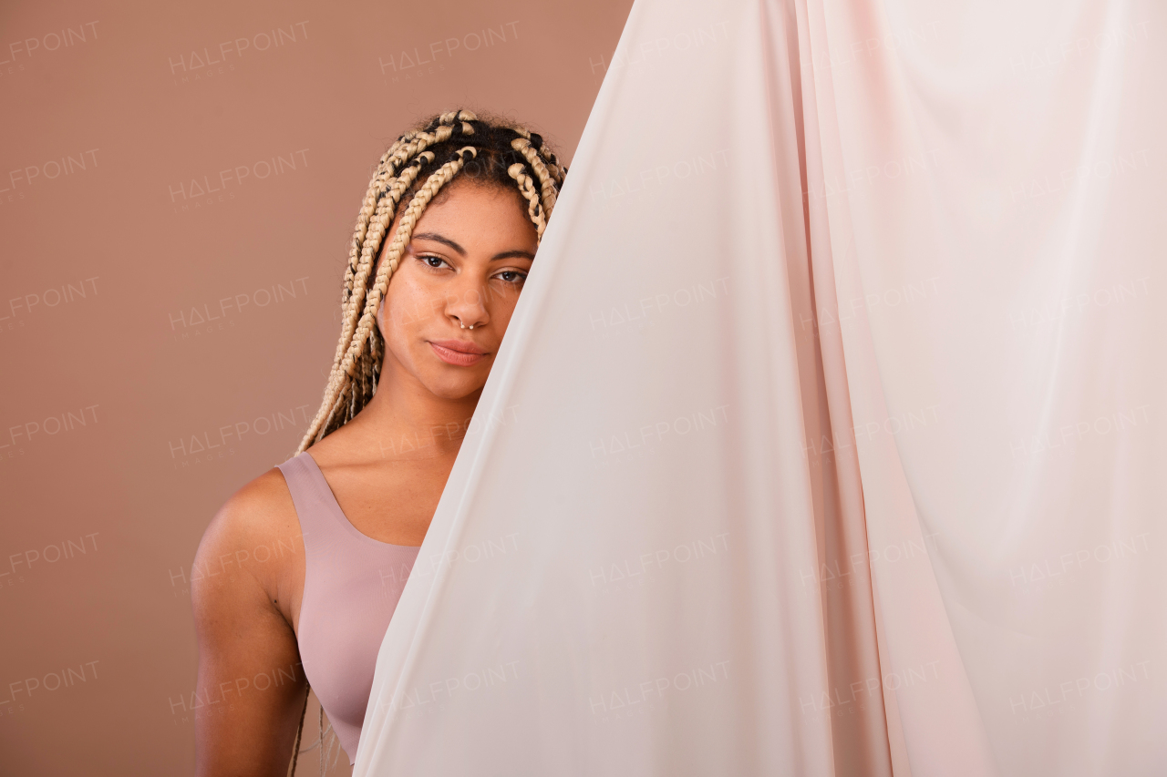 Portrait of a happy multiracial woman, studio shoot.