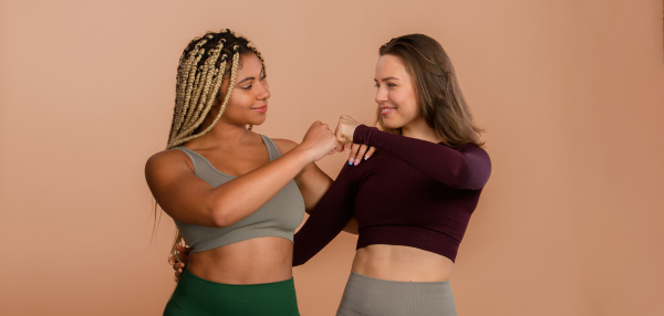 Studio portrait of young friends in sportive clothes.