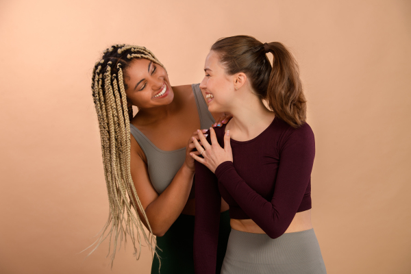 Studio portrait of young friends in sportive clothes.