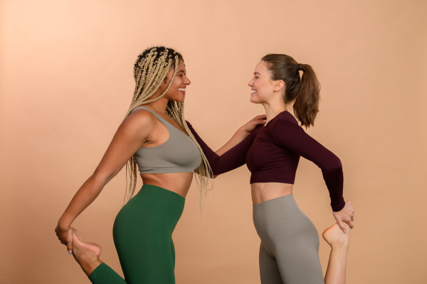 Studio portrait of young friends in sportive clothes.