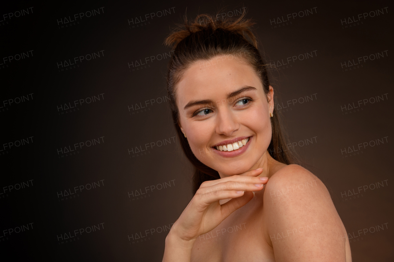 Portrait of a happy young woman, studio shoot.