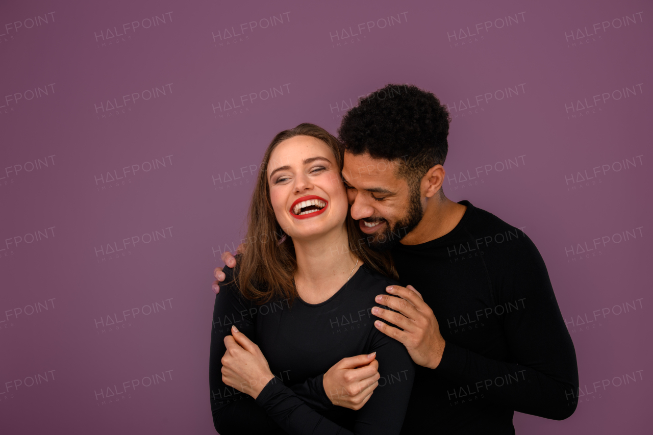 Portrait of a young multiracial couple, studio shoot.