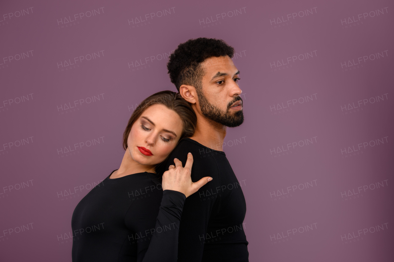 Portrait of a young multiracial couple, studio shoot.