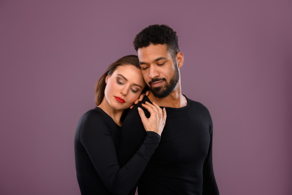 Portrait of a young multiracial couple, studio shoot.