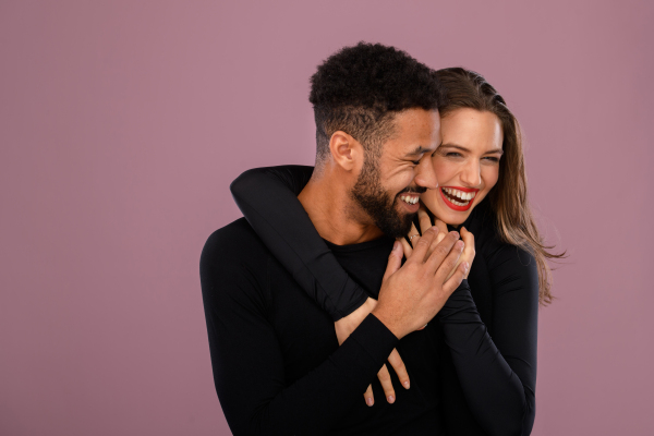 Portrait of a young multiracial couple, studio shoot.