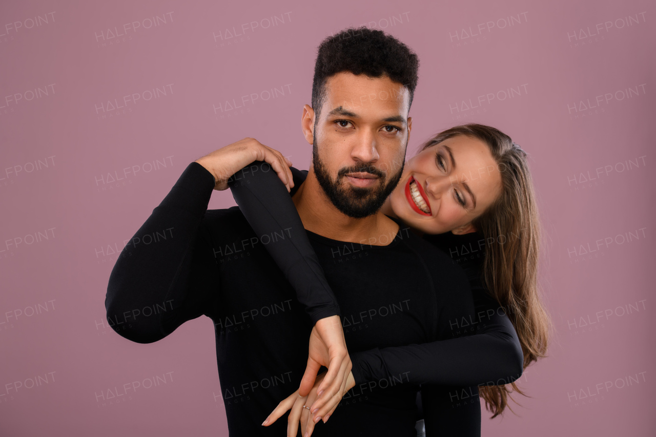 Portrait of a young multiracial couple, studio shoot.