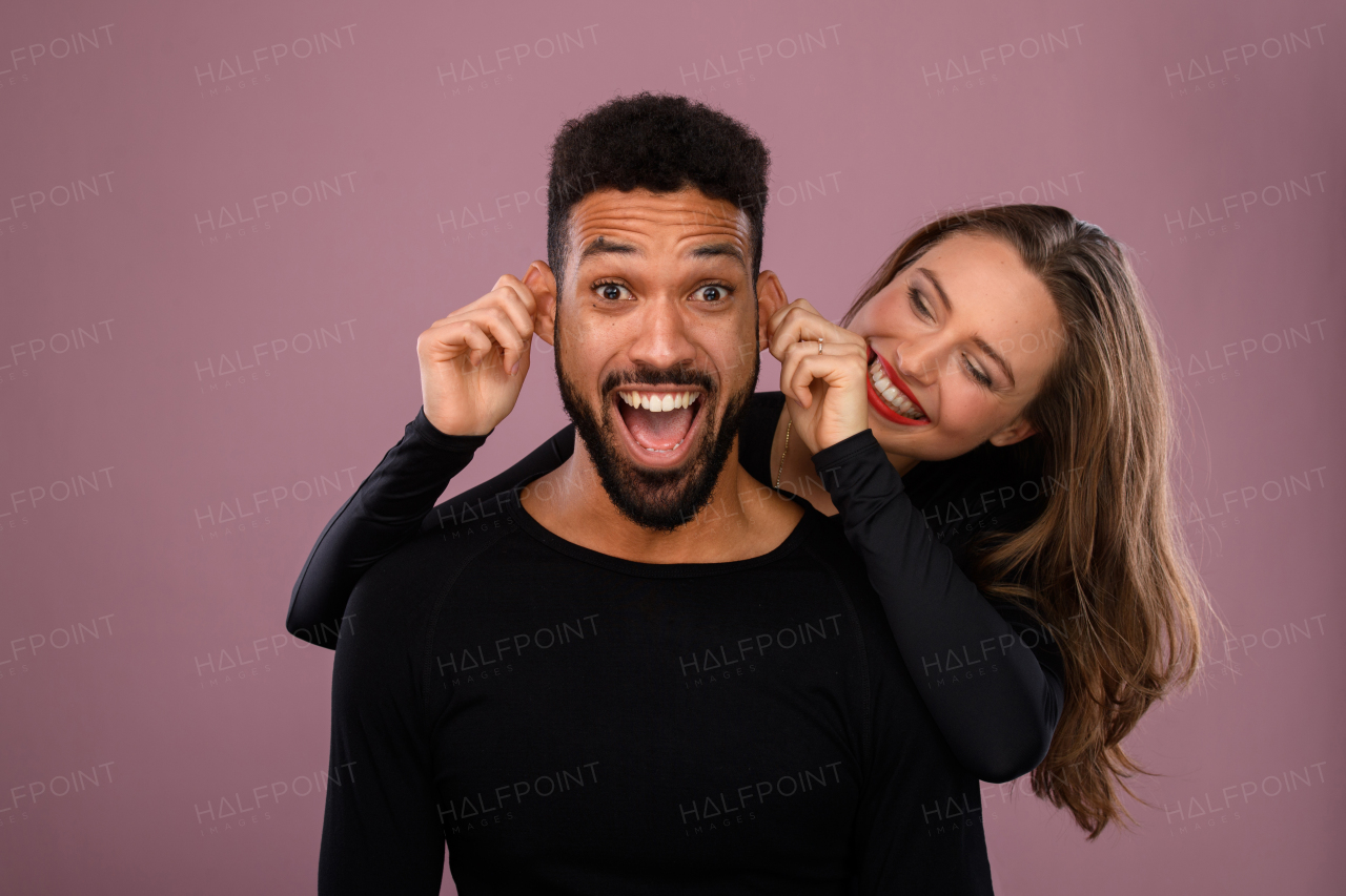 Portrait of a young multiracial couple, studio shoot.