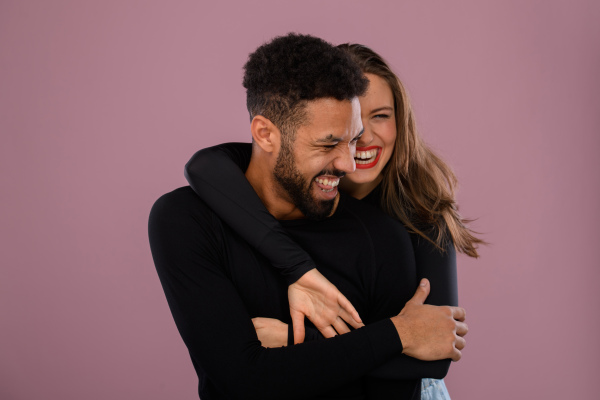 Portrait of a young multiracial couple, studio shoot.