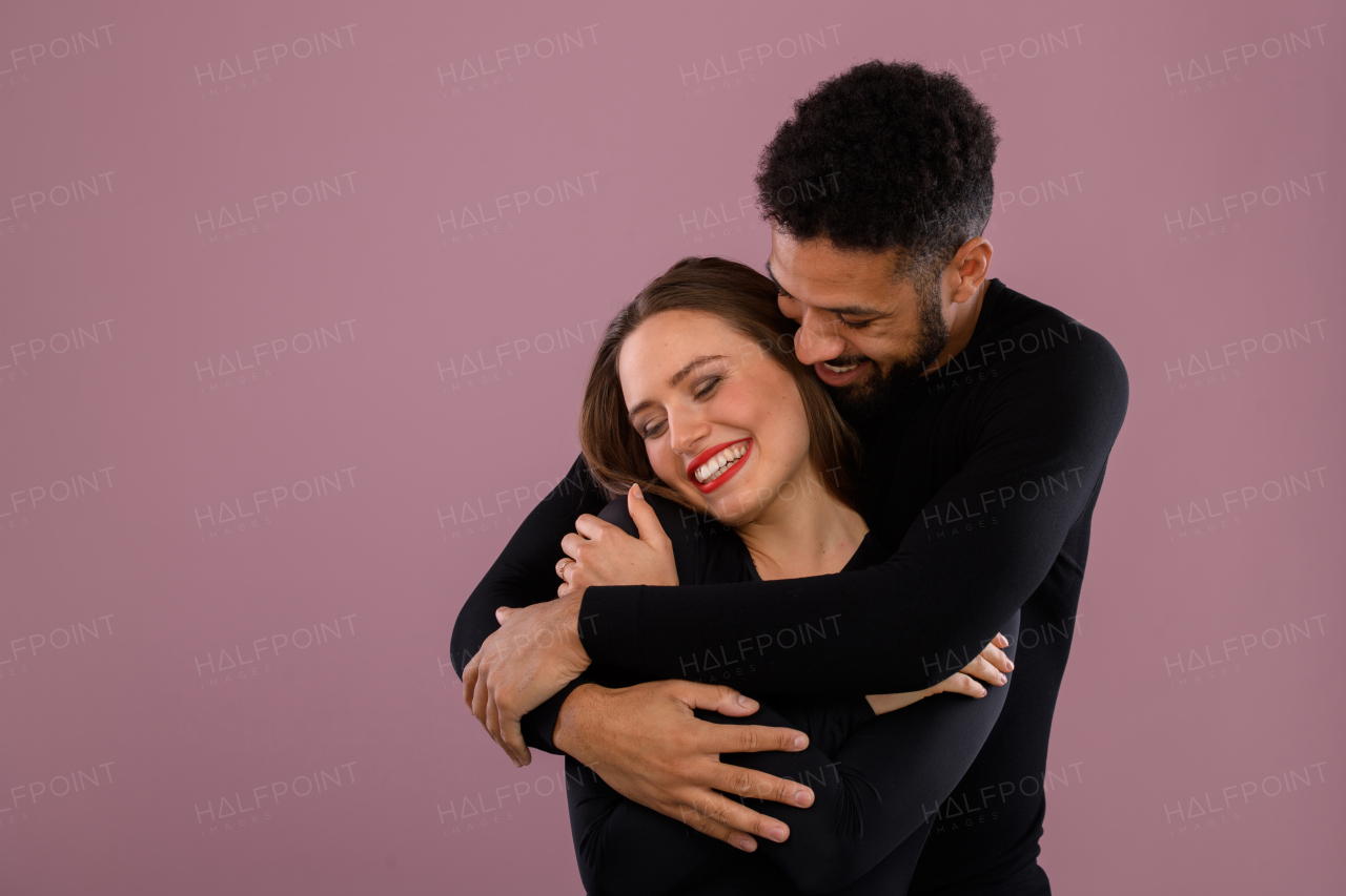 Portrait of a young multiracial couple, studio shoot.