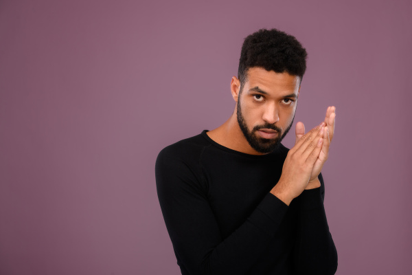 Portrait of young multiracial man in a studio.