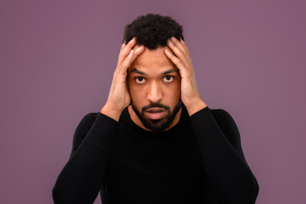 Portrait of young multiracial man in a studio.