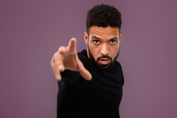 Portrait of young multiracial man in a studio.