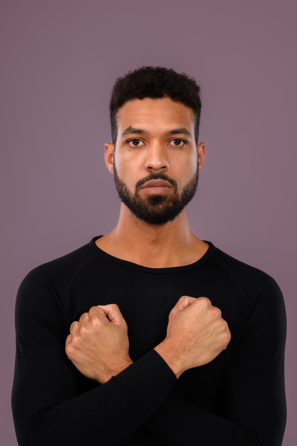 Portrait of young multiracial man in a studio.