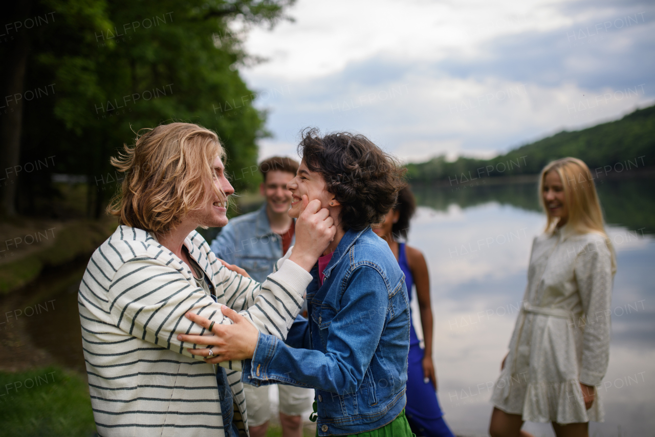 Friends having fun together at a park lauging and hugging, Friendship and lifestyle concepts