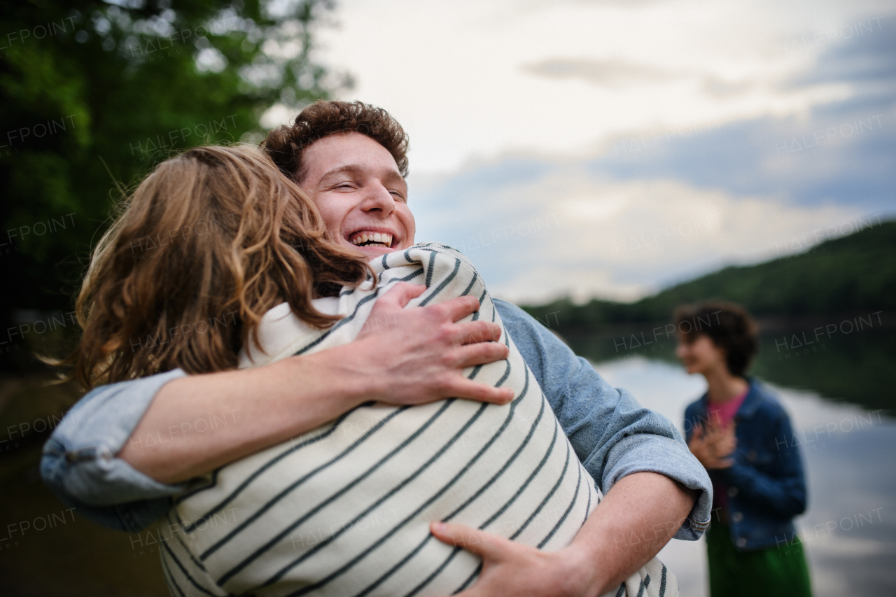 Friends having fun together at a park lauging and hugging, Friendship and lifestyle concepts