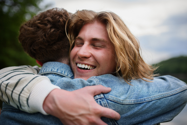 Friends having fun together at a park lauging and hugging, Friendship and lifestyle concepts