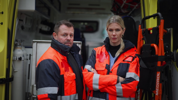 Video of rescuers, colleagues in front of ambulance car.