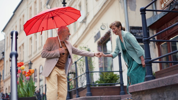 Excited senior couple having fun in a city, dating time.