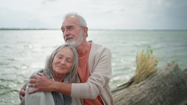 Senior couple embracing and enjoying time together at the beach.