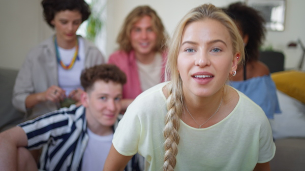 A diverse group of friends with mixed races having fun together and taking selfie indoors, Friendship and lifestyle concepts