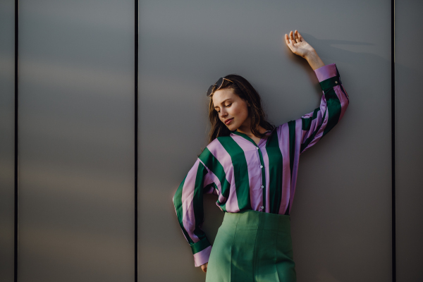 Portrait of happy young woman outdoor in a city.