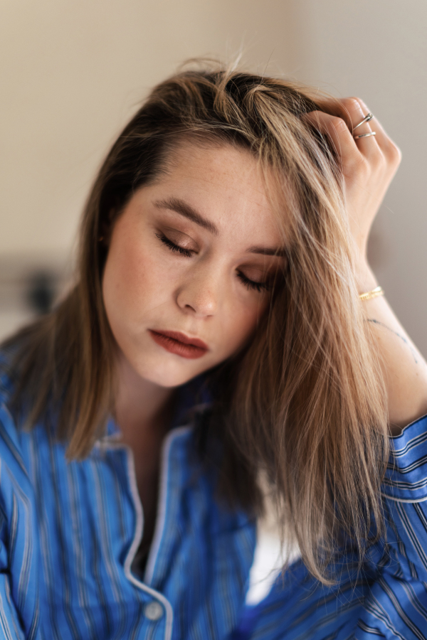 Portrait of young beautiful woman with closed eyes and natural make up.