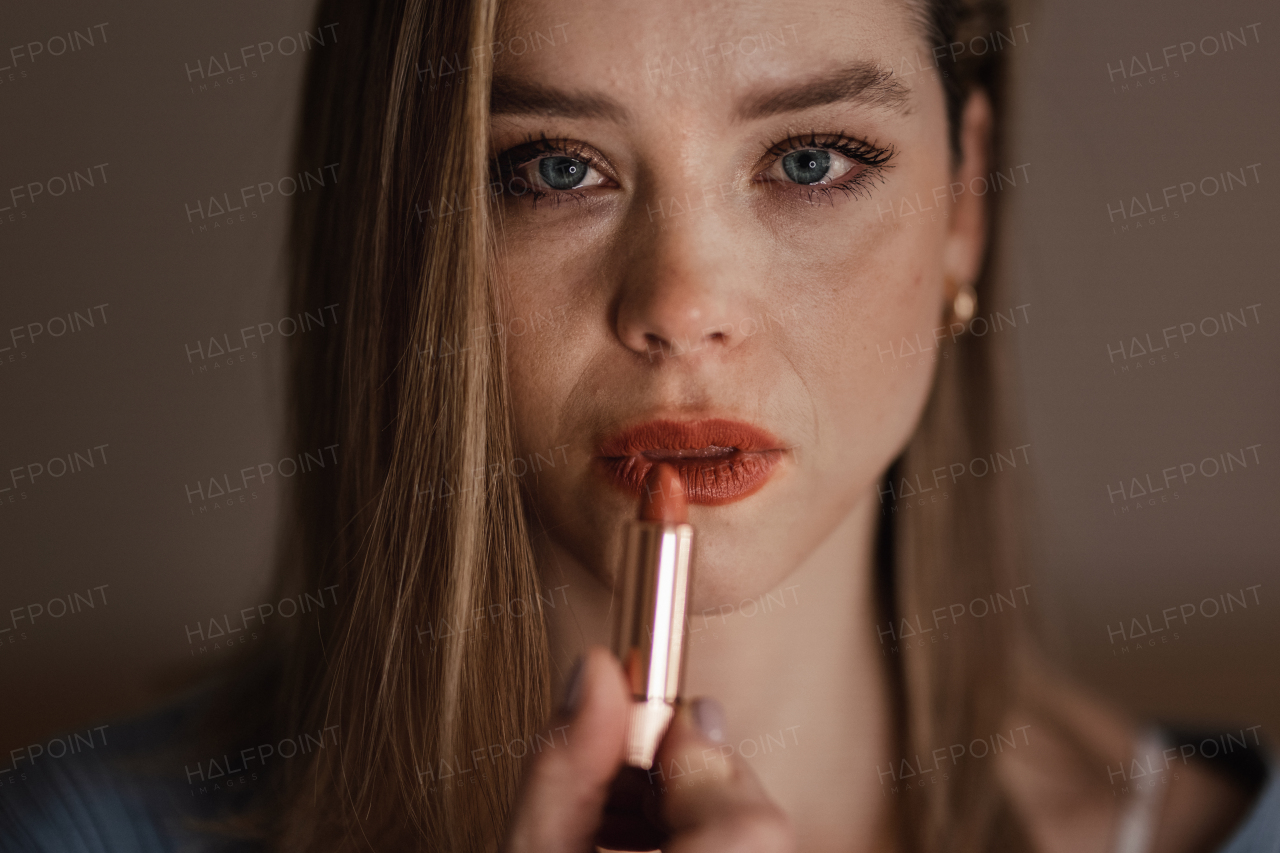 Portrait of crying woman doing the make up.