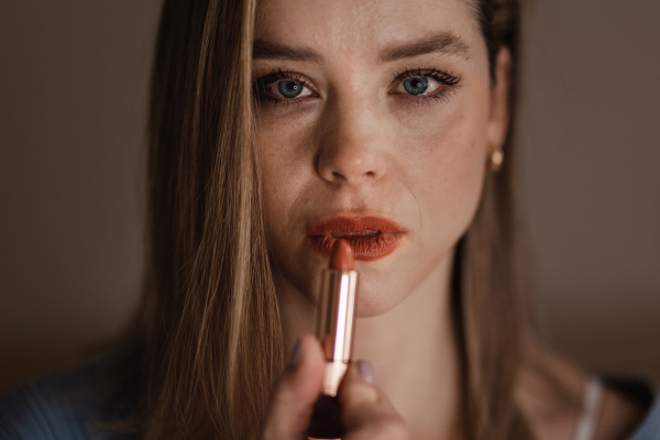 Portrait of crying woman doing the make up.