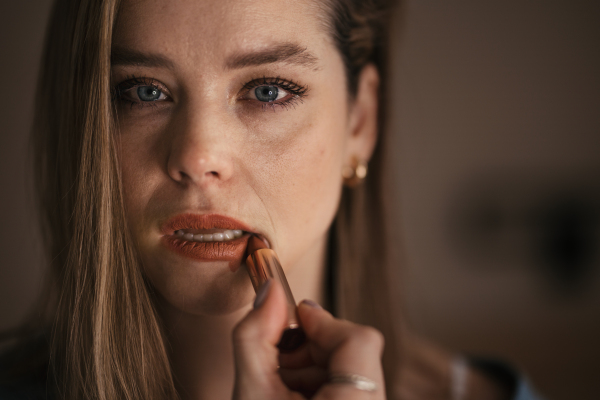 Portrait of crying woman doing the make up.