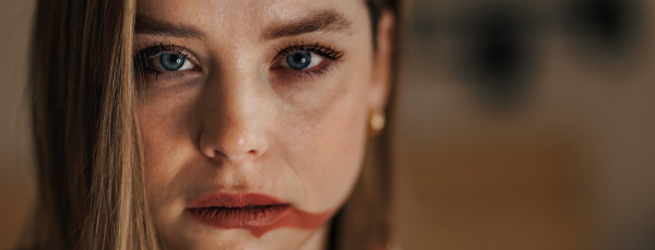 Portrait of crying woman doing the make up.