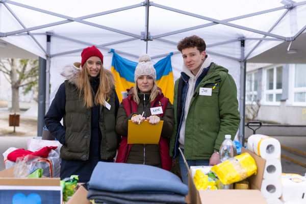 The team of volunteers distributing food, drinks and other donations to refugees on the Ukrainian border.