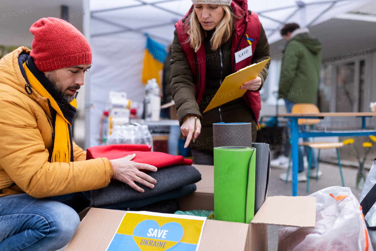 The volunteers distributing blankets and other donations to refugees on the Ukrainian border.