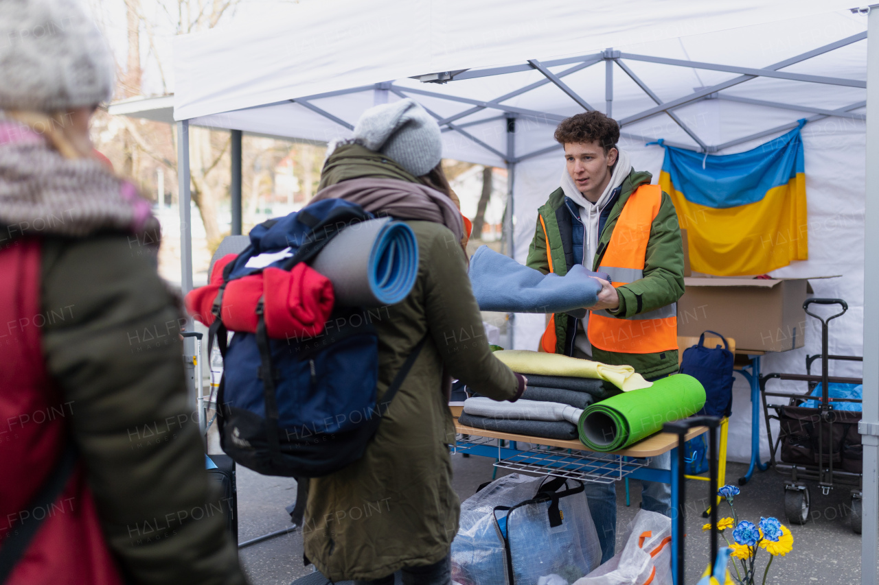 The volunteers distributing blankets and other donations to refugees on the Ukrainian border.