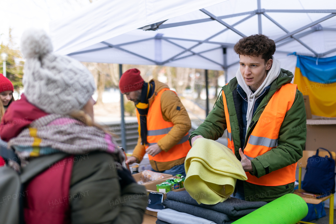 The volunteers distributing blankets and other donations to refugees on the Ukrainian border.