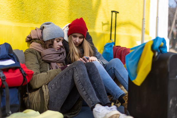 The Ukrainian immigrants crossing border and sitting and waiting for registration.