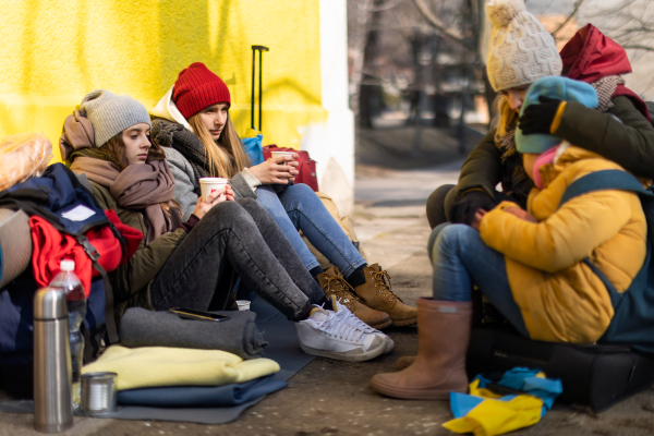 The Ukrainian immigrants crossing border and sitting and waiting for registration.