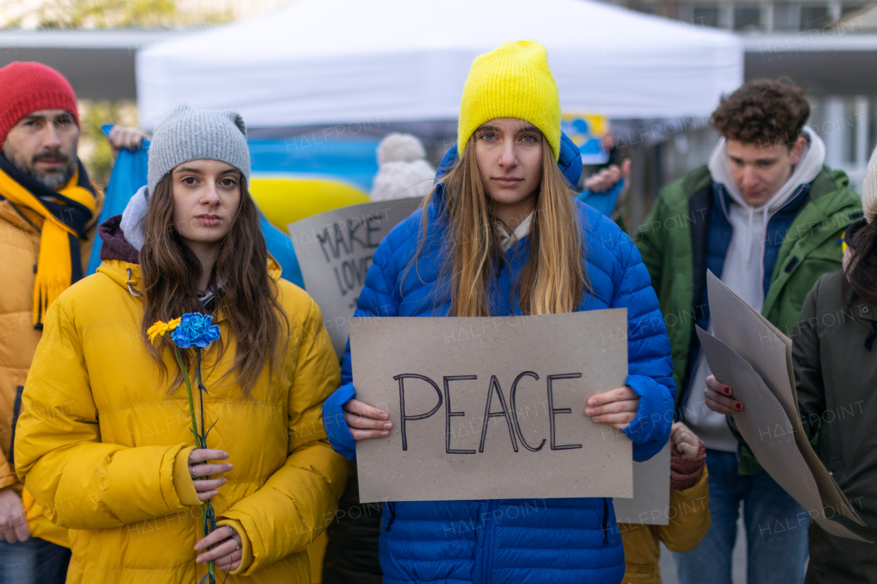 Protest against Russian invasion of Ukraine. People holding anti war sings and banners in the street.