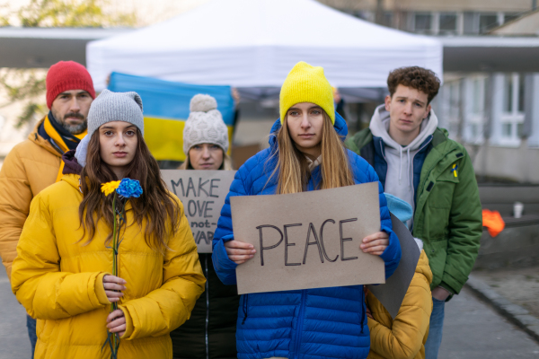 Protest against Russian invasion of Ukraine. People holding anti war sings and banners in the street.