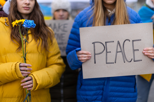 Protest against Russian invasion of Ukraine. People holding anti war sings and banners in the street.