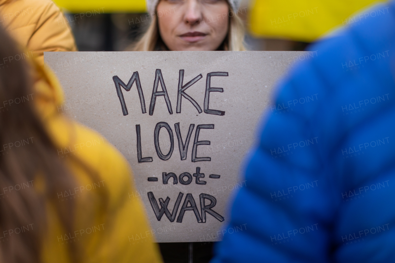 Protest against Russian invasion of Ukraine. People holding anti war sings and banners in the street.