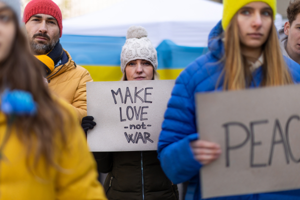 Protest against Russian invasion of Ukraine. People holding anti war sings and banners in the street.