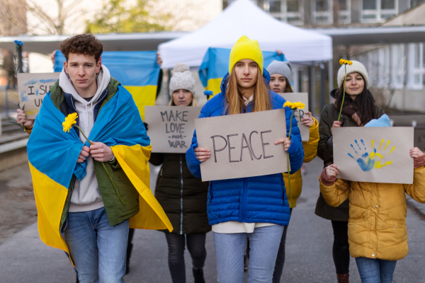 Protest against Russian invasion of Ukraine. People holding anti war sings and banners in the street.