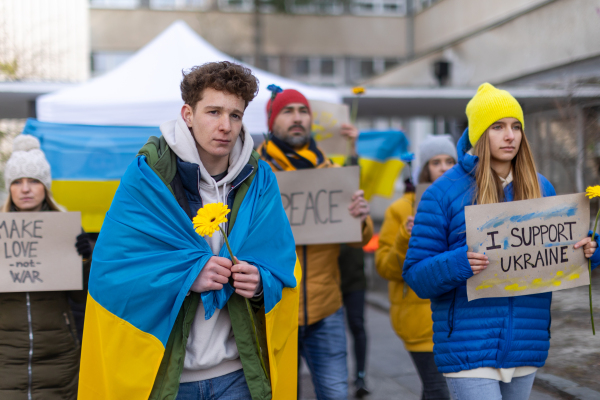 Protest against Russian invasion of Ukraine. People holding anti war sings and banners in the street.