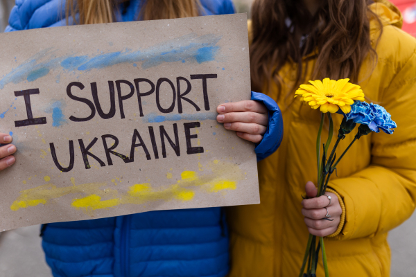 Protest against Russian invasion of Ukraine. People holding anti war sings and banners in the street.