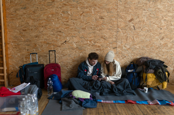 Ukrainian war refugees in a temporary shelter and help center.